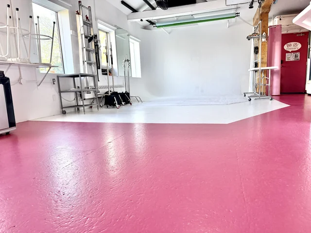 Pink floors and the full studio space